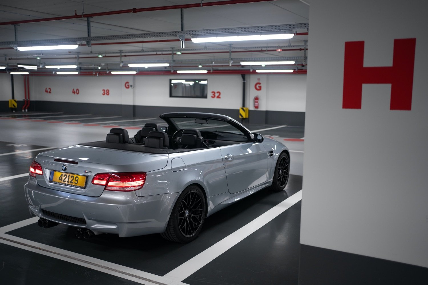 Alyssa – BMW M3 E93 – open in parking garage – photo by Fares Hammoud