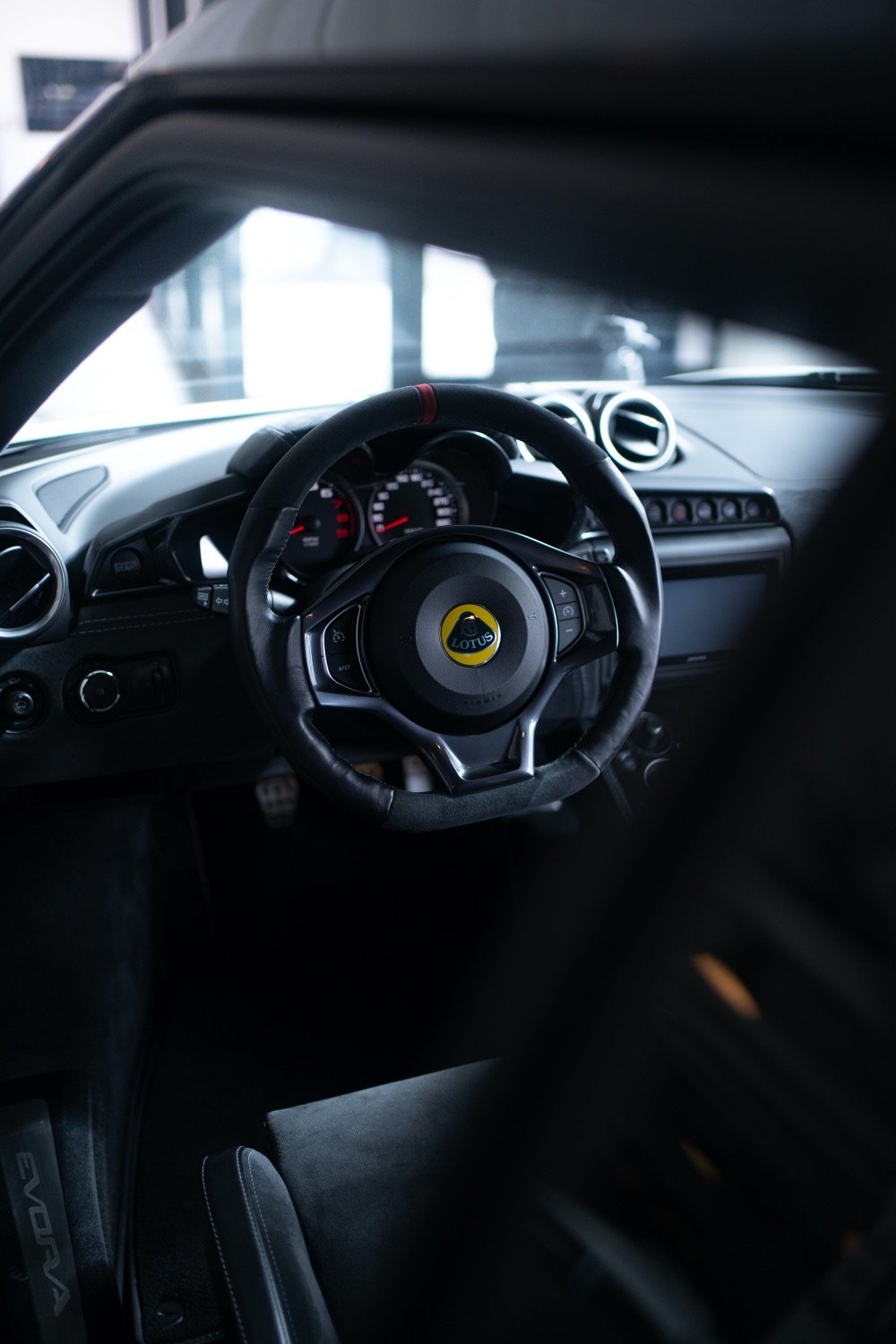 Ellie – Lotus Evora 400 – Steering wheel portrait – photo by Fares Hammoud